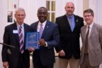On behalf of the city of Buffalo, Mayor Byron Brown (second from left) accepts an award accompanied by Steve Stepniak, DPW Commissioner, and Brendan Mehaffy, OSP Director. Award is presented by Jerry Kelly. On behalf of the city of Buffalo, Mayor Byron Brown (second from left) accepts an award accompanied by Steve Stepniak, DPW Commissioner, and Brendan Mehaffy, OSP Director. Award is presented by Jerry Kelly.