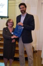 Justin Booth of GoBike Buffalo accepting an award, presented by Gail Plato. Justin Booth of GoBike Buffalo accepting an award, presented by Gail Plato.